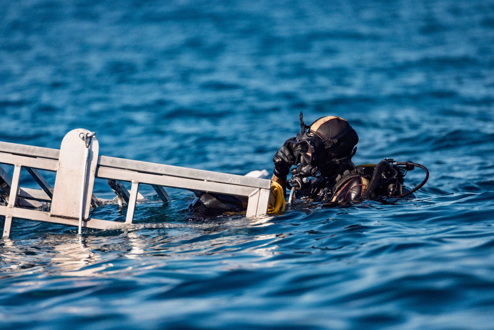 Kendyl Berna preparing dive gear on deck